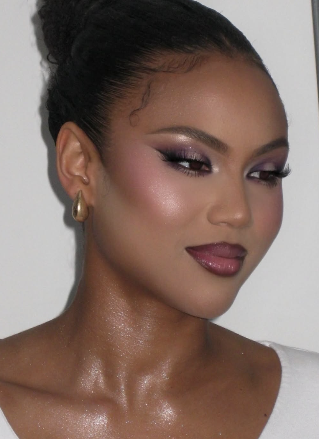 Close-up of glossy cranberry lip color with natural-looking complexion