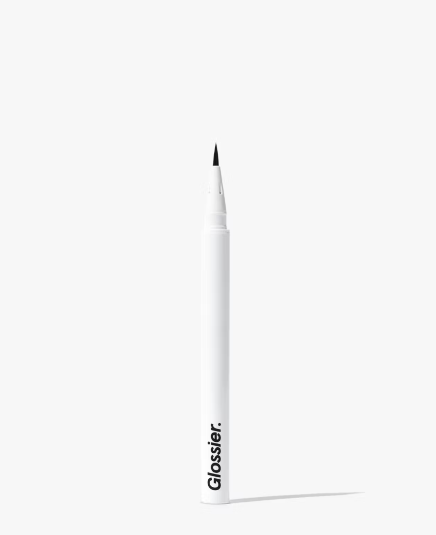 A white tube of Glossier liquid eyeliner standing upright against a clean, light grey background.