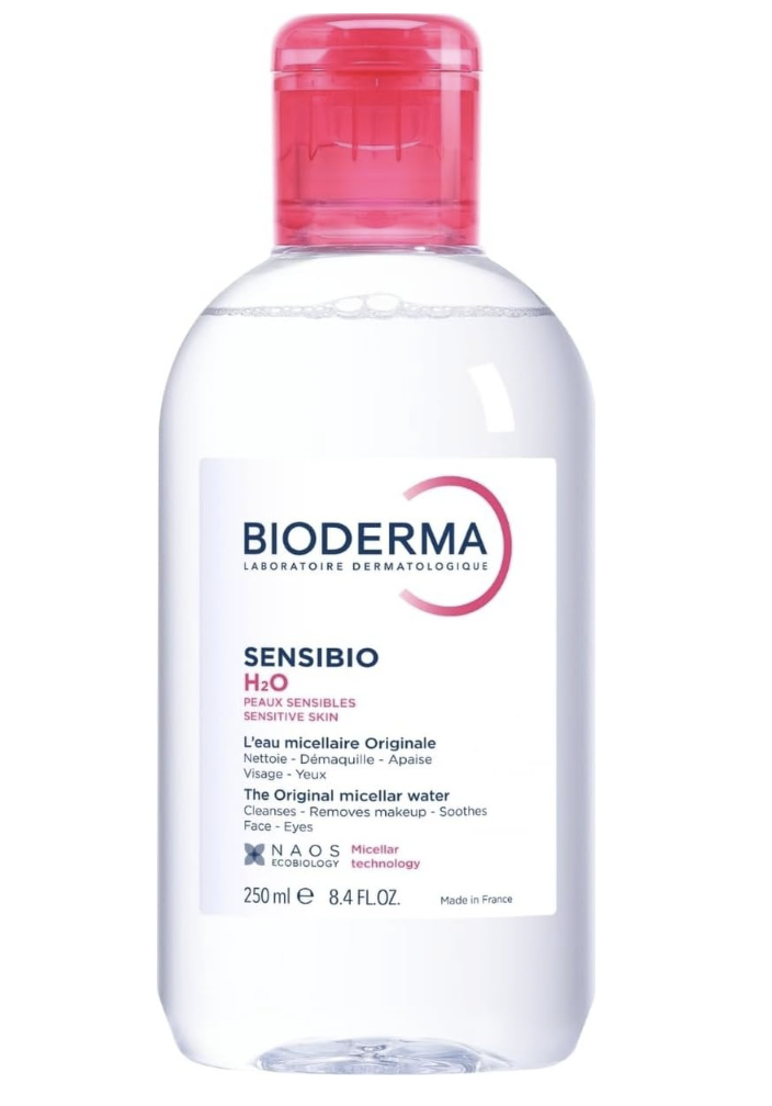Bioderma Sensibio H2O micellar water with cotton pads for gentle makeup removal.