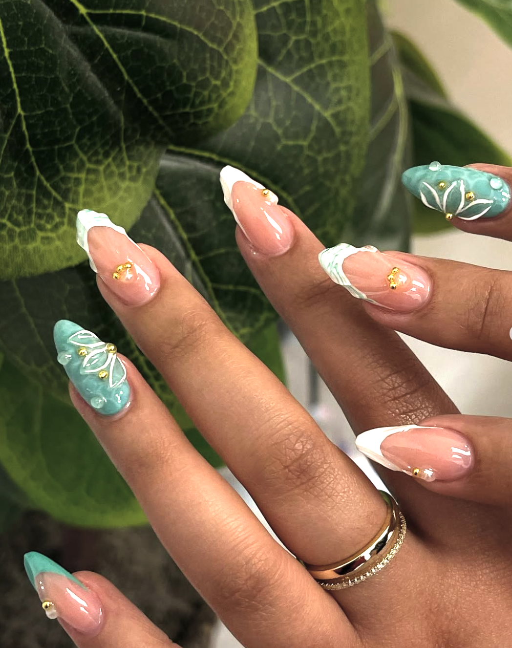Sheer nails with reflective aqua chrome French tips