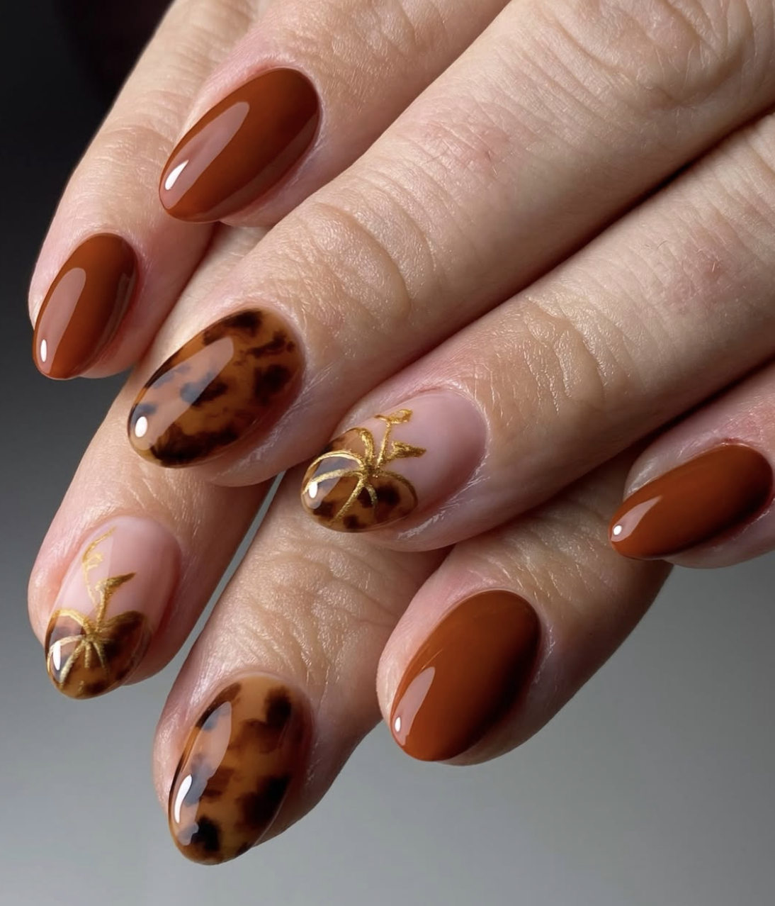 Matte terracotta manicure with tonal glossy pumpkin details