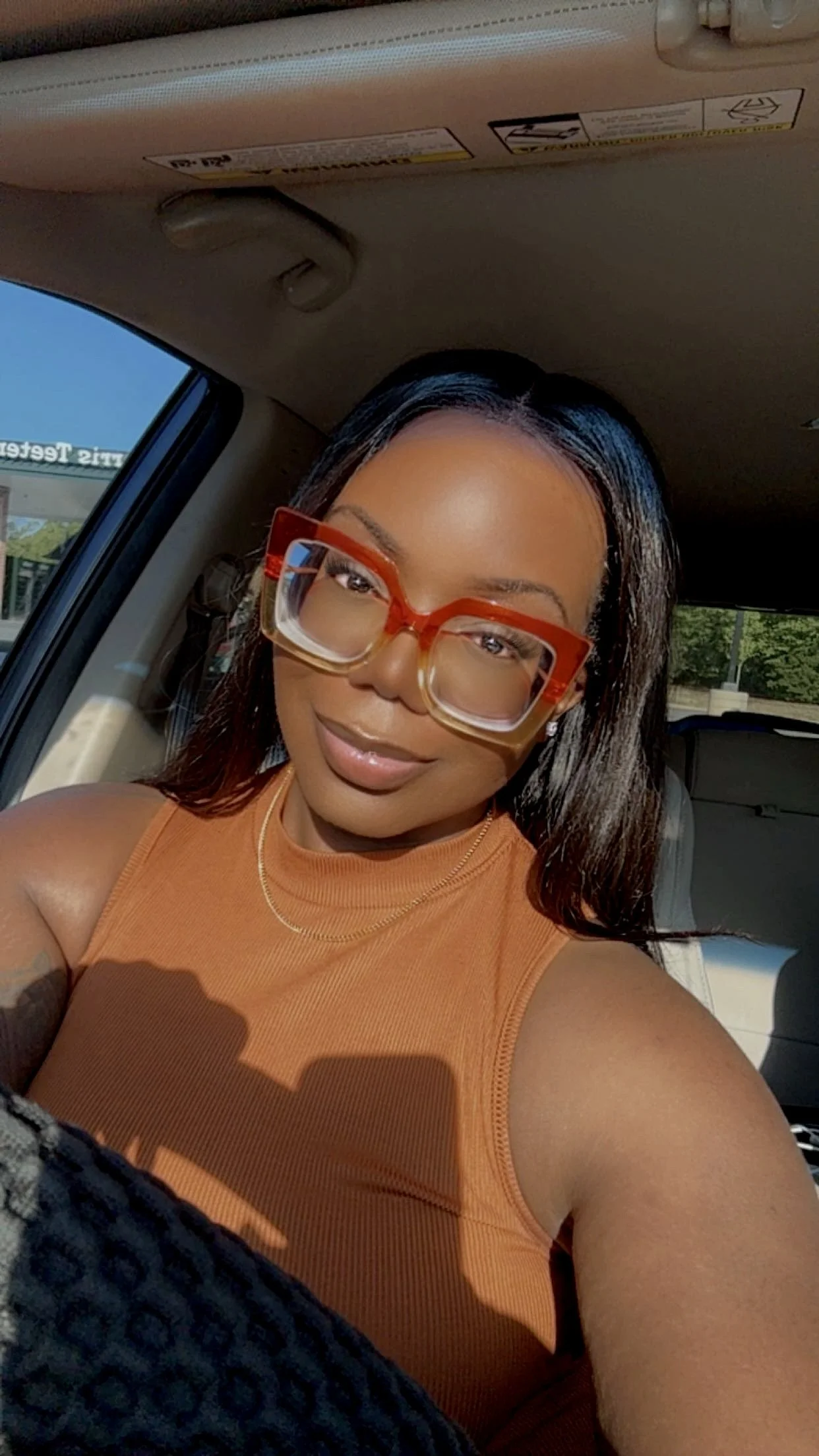 Woman with a heart face shape wearing eyeglasses, styling inspiration for square face frames.
