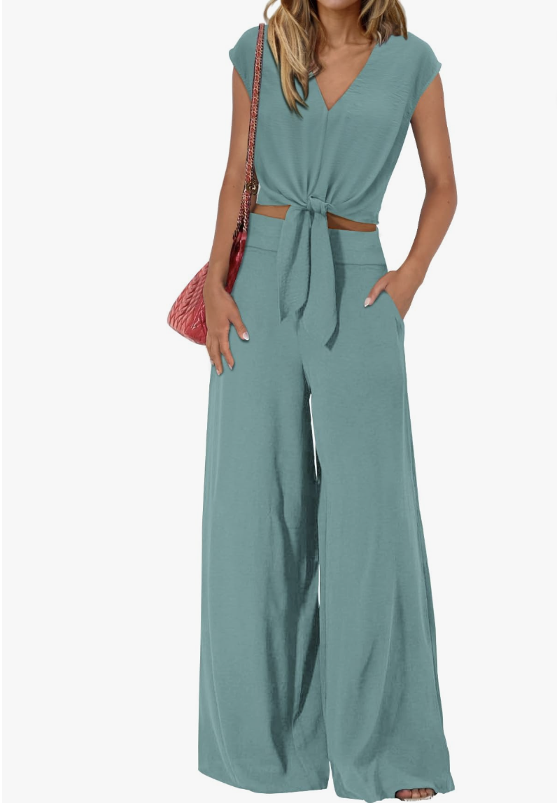A matching two-piece women's lounge set in solid blue-green featuring a cap-sleeve V-neck belted crop top and matching relaxed wide-leg trousers.