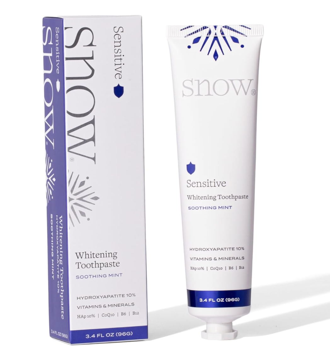 Box and tube of SNOW Sensitive Teeth Whitening Toothpaste in Soothing Mint flavor, featuring a white, silver, and blue design with hydroxyapatite 10%.