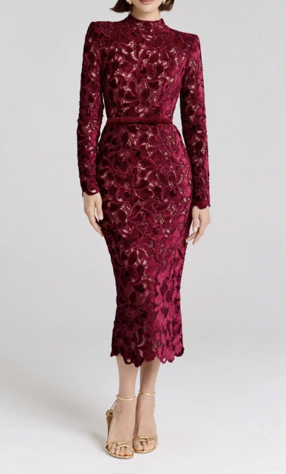 Nadine Merabi Diane long-sleeve burgundy lace sheath cocktail dress paired with metallic gold strappy heels
