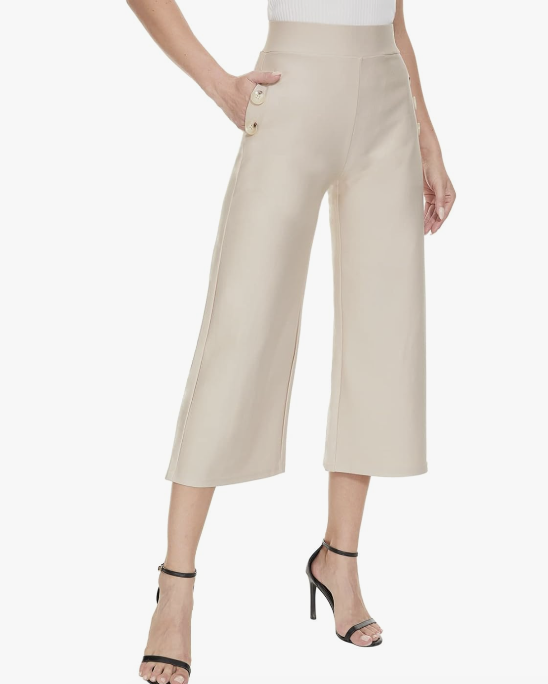 A fashion editor-approved styling guide on what shoes to wear with cropped pants, featuring beige culottes paired with black minimalist ankle-strap heels to elongate the leg.