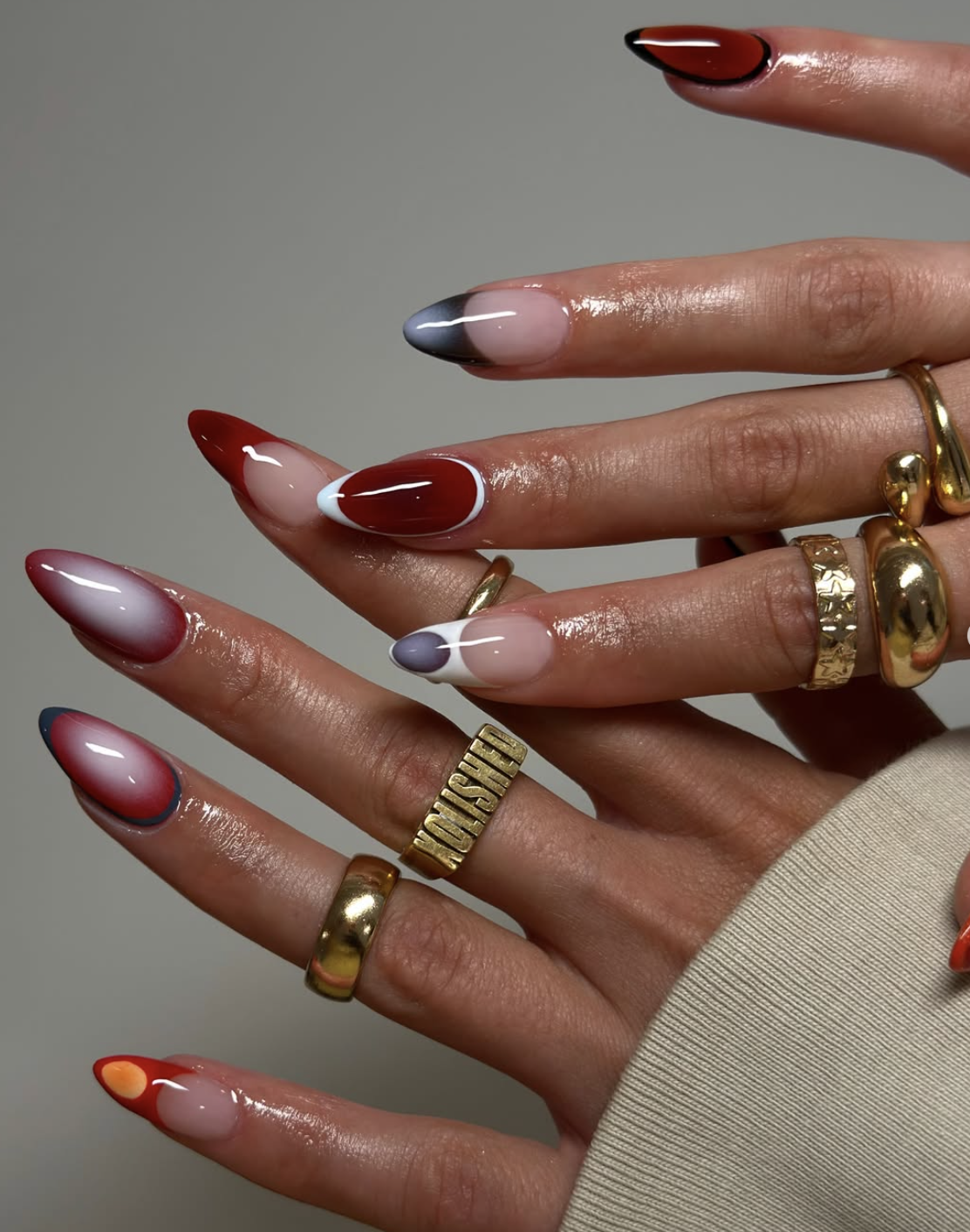 Oxblood aura design over a sheer nude manicure.