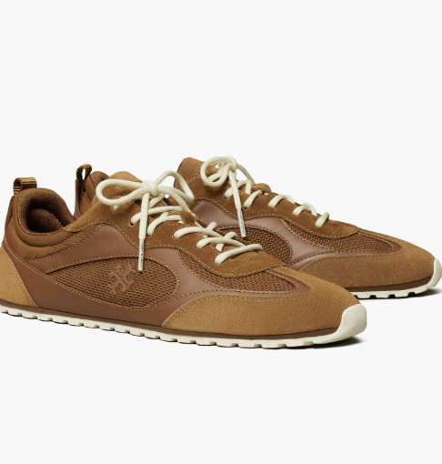 A product photo of the Tory Burch Field Sneaker in a rich brown suede and leather combination with a white athletic sole and classic lace-up design.