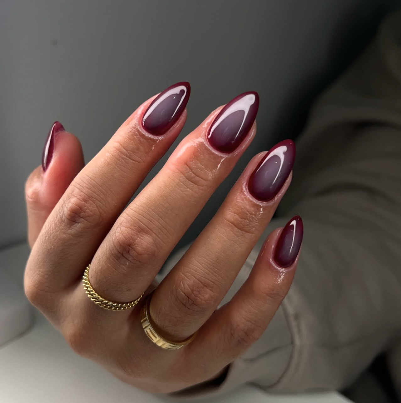September nail idea featuring burgundy aura nails