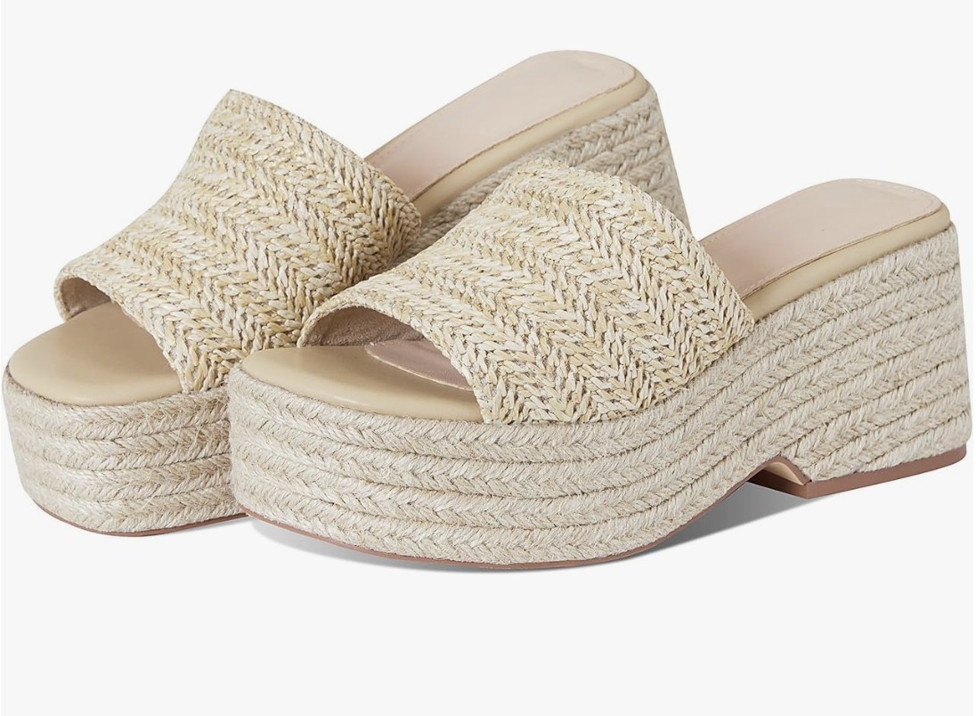 A pair of beige slip-on platform espadrille sandals with a woven texture, perfect for a casual summer BBQ outfit.