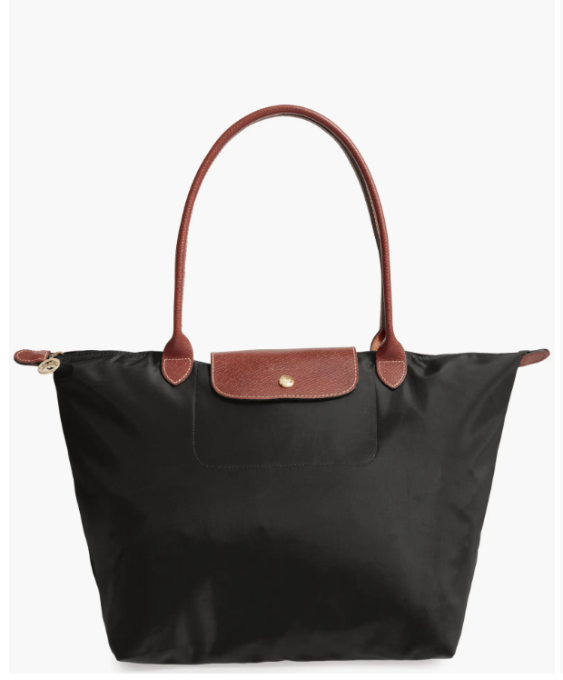 Classic nylon Longchamp tote with leather trim and a secure top zipper closure.
