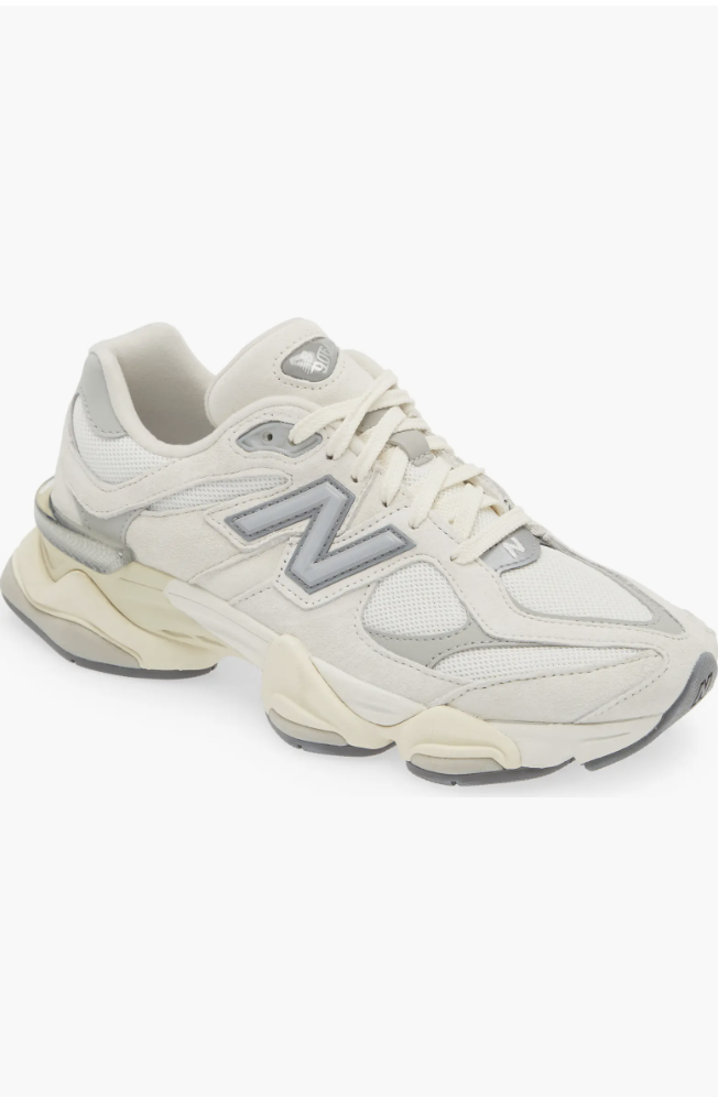 New Balance 9060 sneakers in a sea salt and white colorway featuring a chunky, sculpted midsole and wavy design lines.