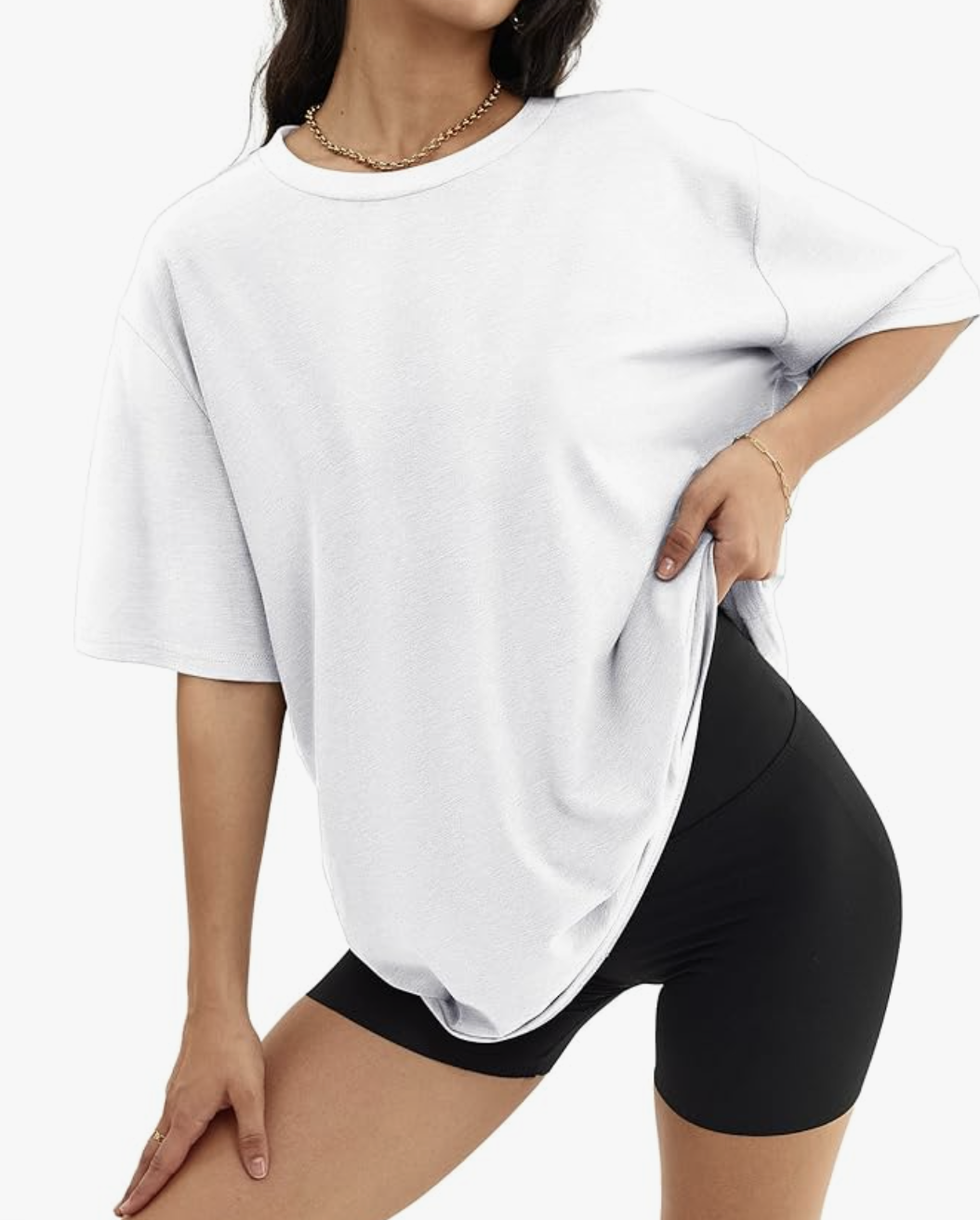 A close-up of a women's oversized white t-shirt with a relaxed fit and crew neckline, demonstrating a key staple for a fashion editor-inspired outfit.
