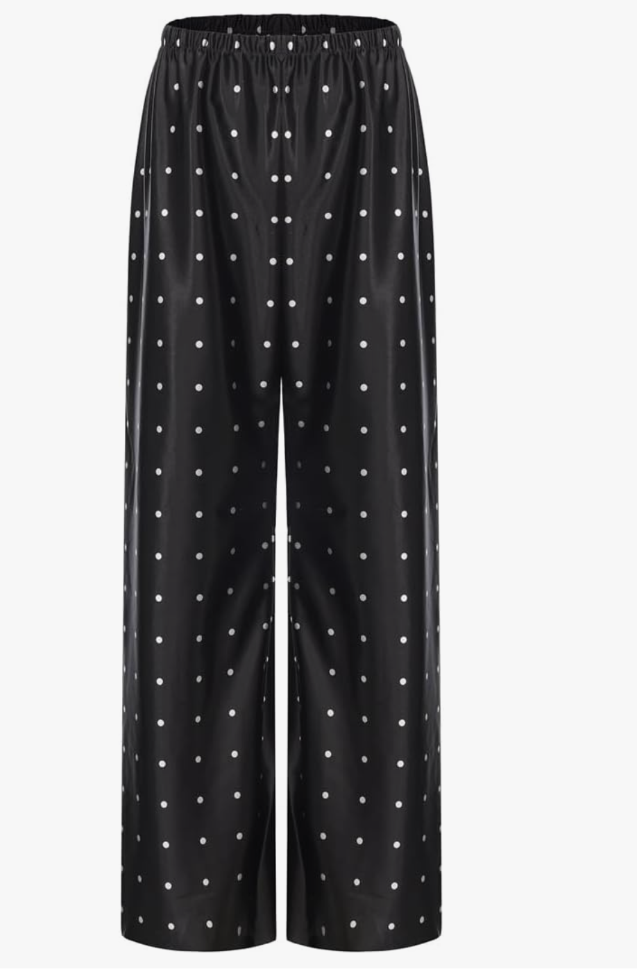 A pair of loose, wide-leg black athletic track pants with a white polka dot print and an elastic waistband, shown on a white background.