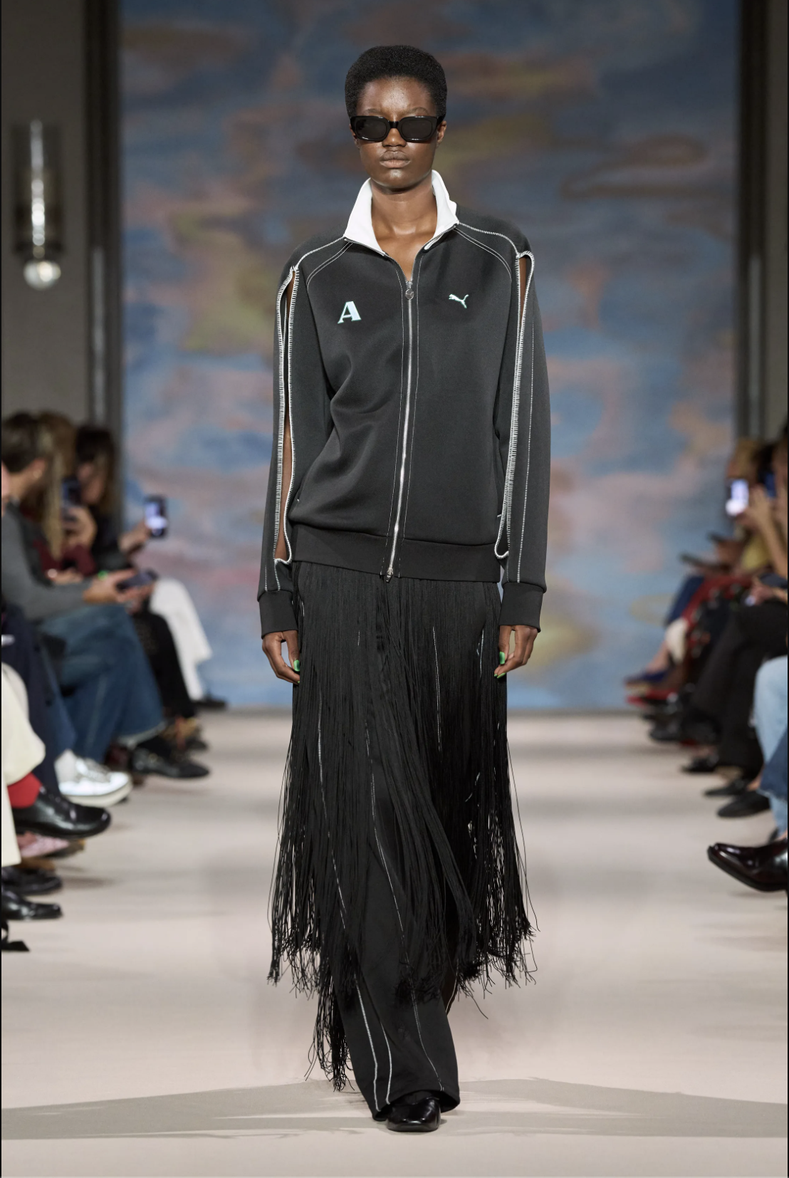 Model wears a black fringed Ahluwalia x PUMA tracksuit on the Spring 2027 runway.