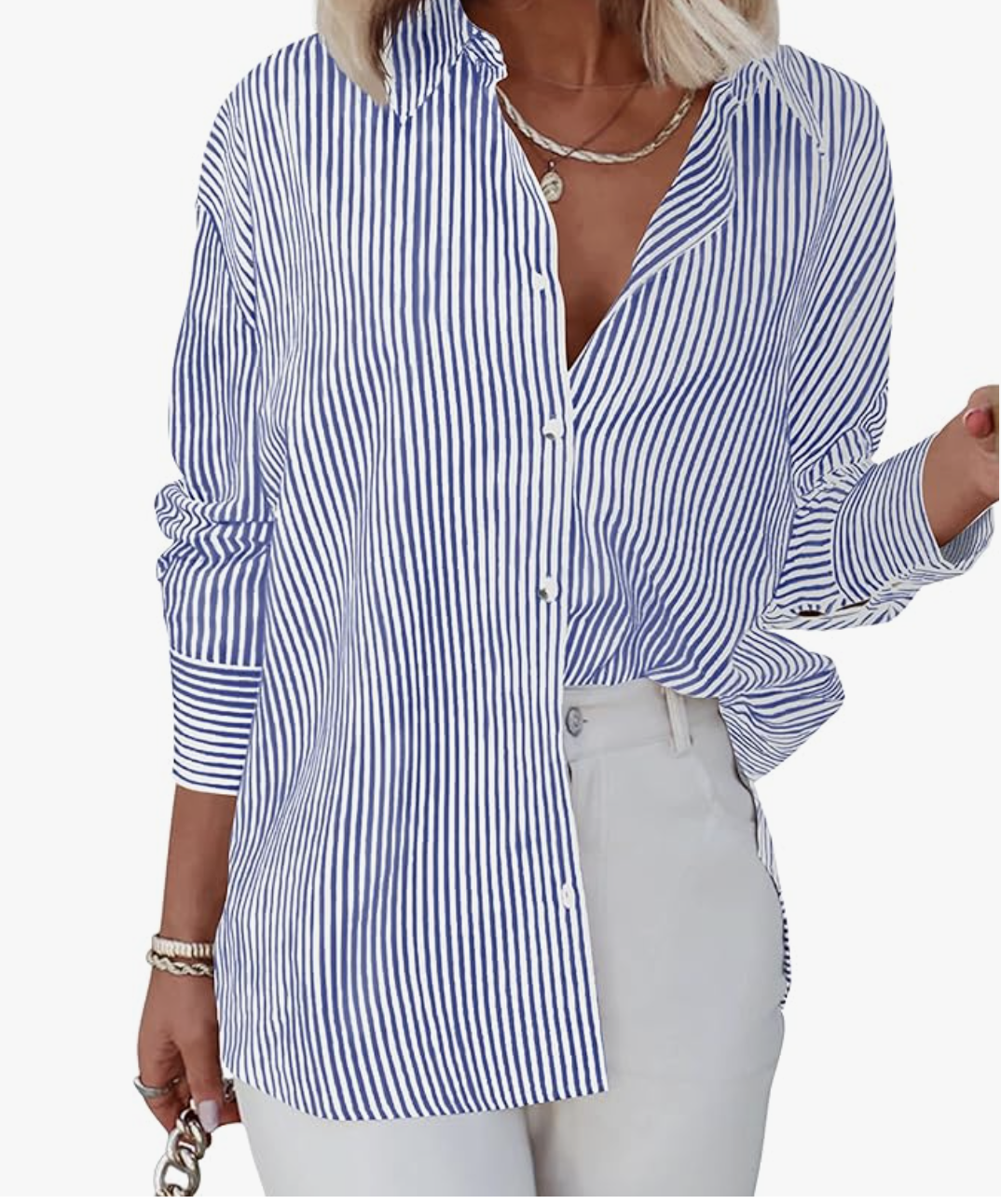 A woman wearing a blue and white striped button-down shirt partially tucked into white high-waisted wide-leg jeans.