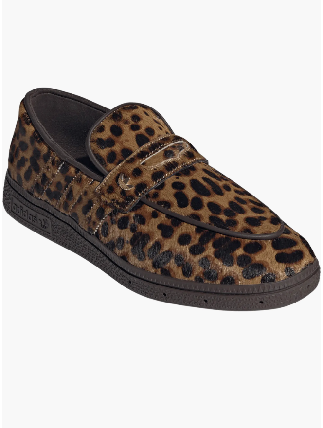 An Adidas Handball Spezial Loafer featuring a bold brown and black leopard print pony-hair upper with classic black stripes and a dark gum sole.