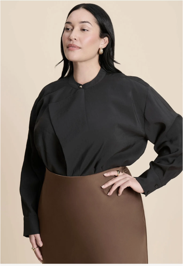 ELOQUII surplice collared top with an open diagonal neckline.
