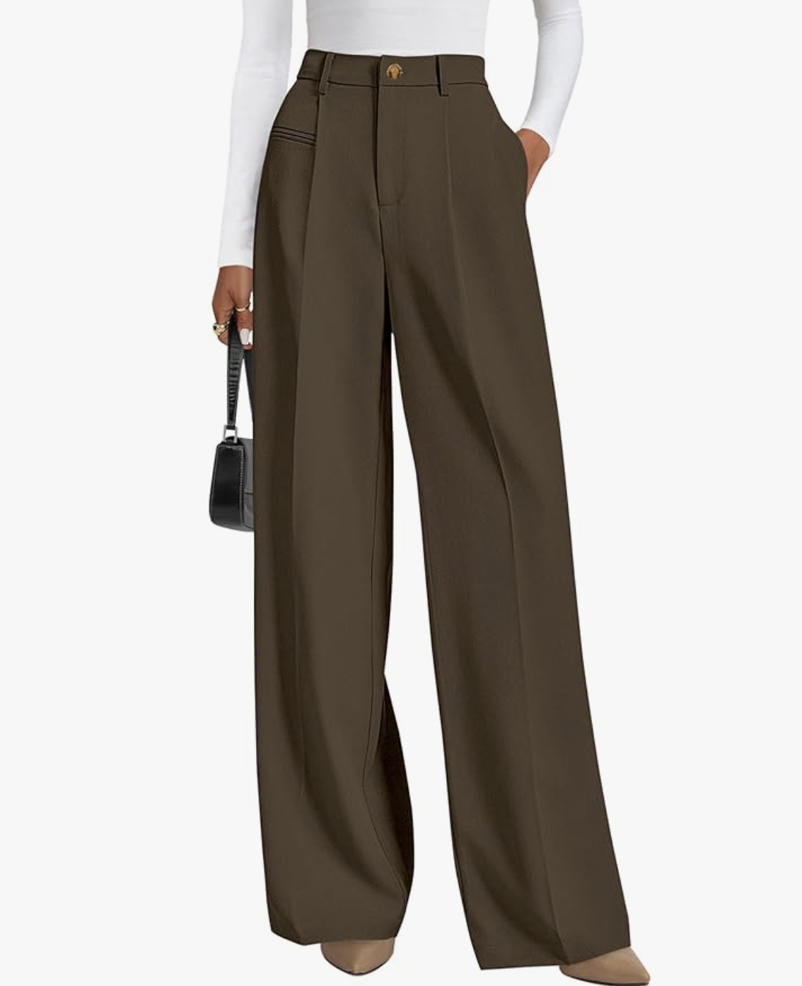 A woman wearing chocolate brown high-waisted wide-leg dress pants by Amazon, styled with a white long-sleeve bodysuit and a black handbag for a professional work capsule wardrobe.