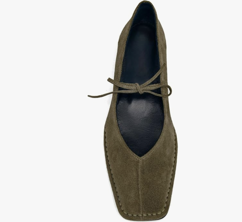 A pair of olive green suede square-toe ballet flats with thin lace-up detailing, a comfortable and trendy footwear option for a minimalist business casual capsule wardrobe.