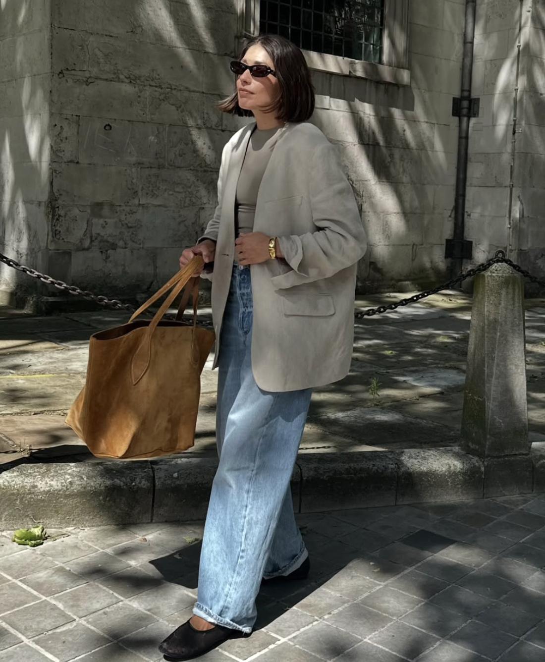 A charcoal blazer over a white tee styled for fall, featured in an Autum Love guide