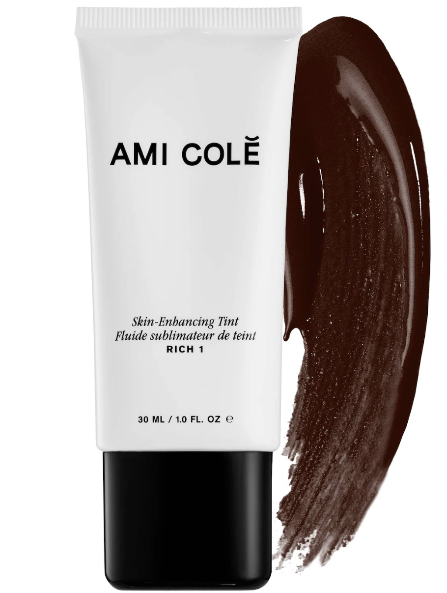 Ami Colé Skin Enhancing Tinted Moisturizer bottle with a swatch showing a rich, dewy pigment for deep skin tones and a radiant, skin-like finish.