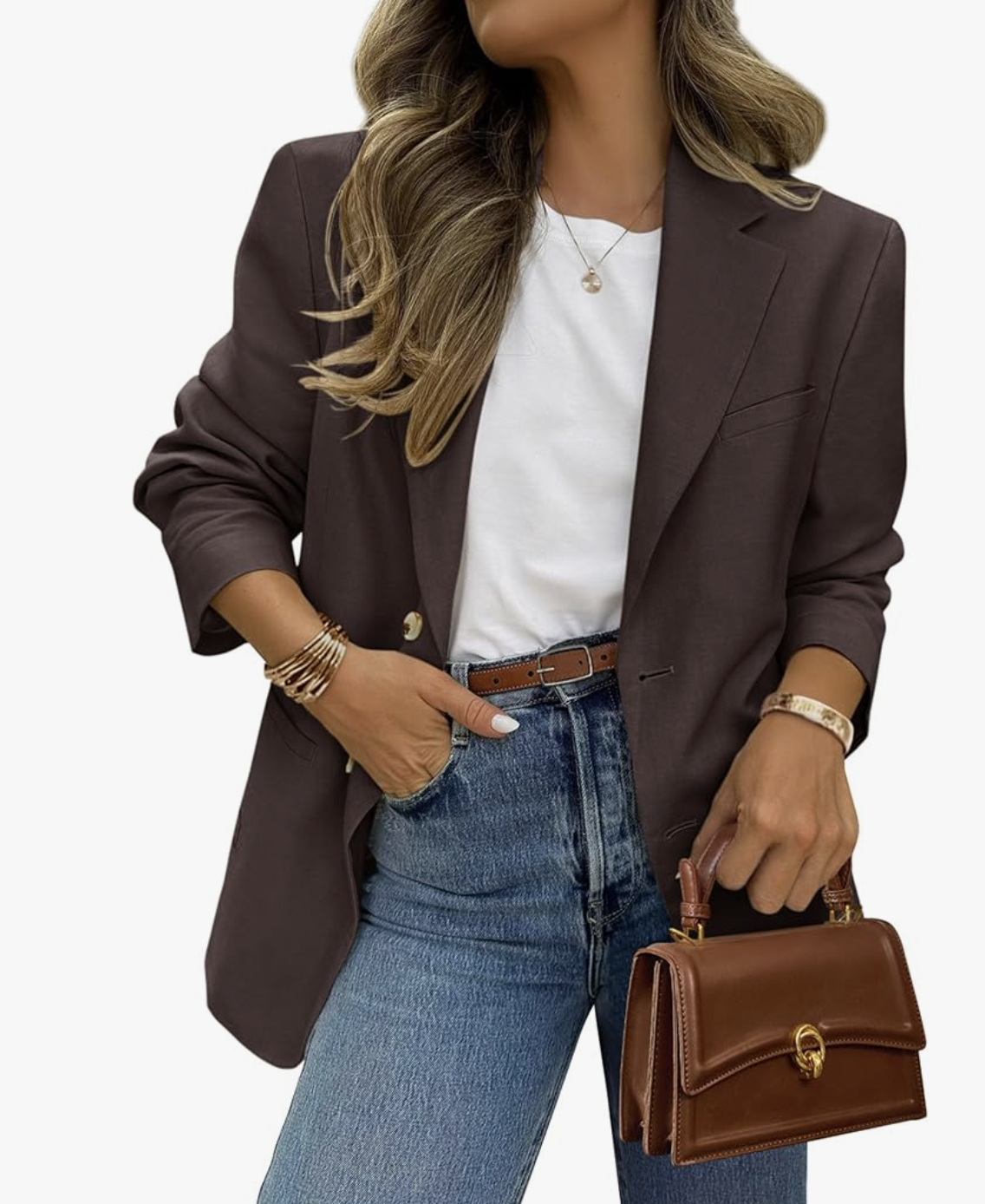A woman wearing an Amazon casual long-sleeve open-front blazer in a rich brown color, layered over a white t-shirt and paired with high-waisted blue jeans and a matching brown leather belt.