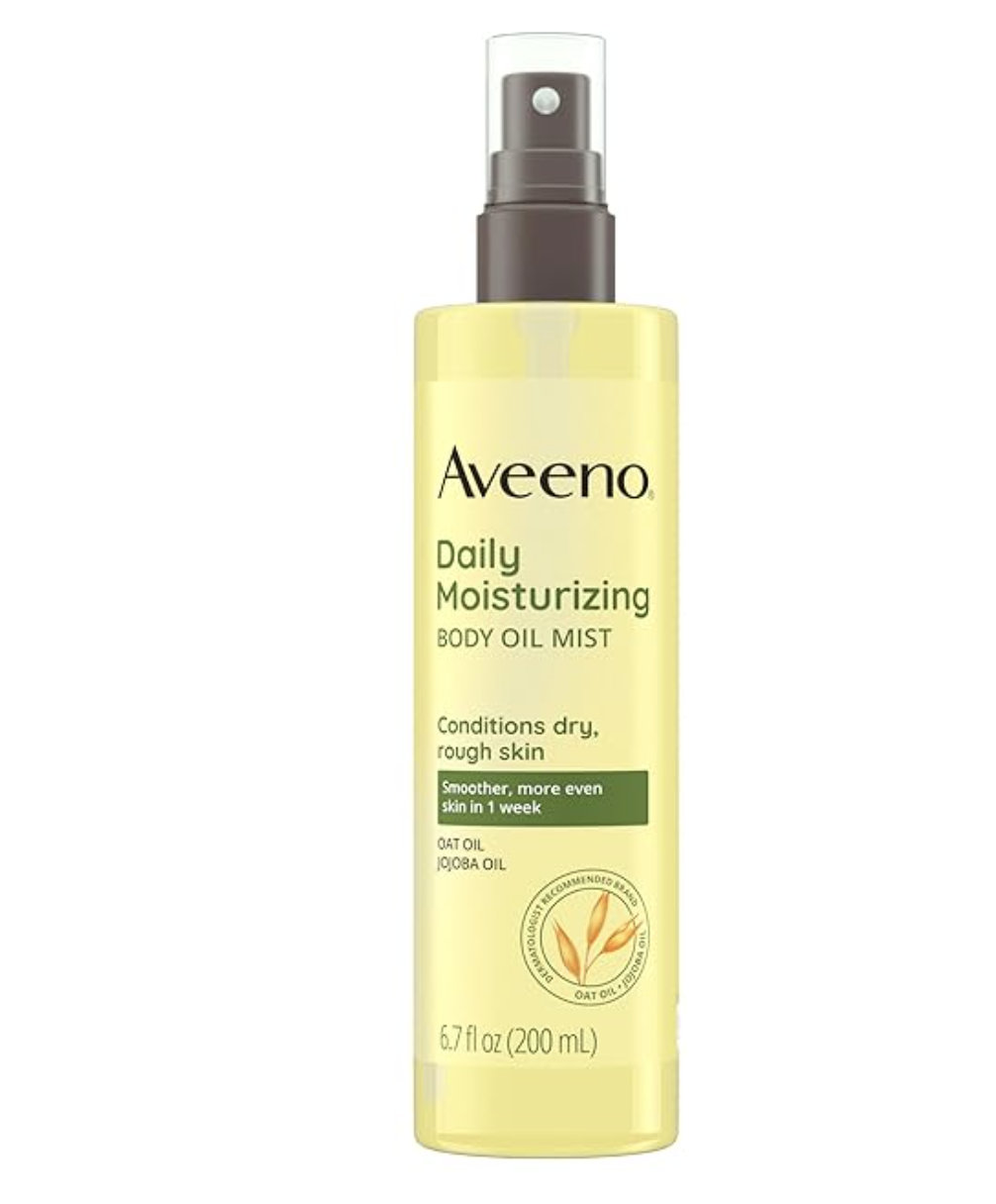 A 6.7 fl oz bottle of Aveeno Daily Moisturizing Dry Body Oil Mist featuring oat and jojoba oil, shown with its signature yellow and green label.