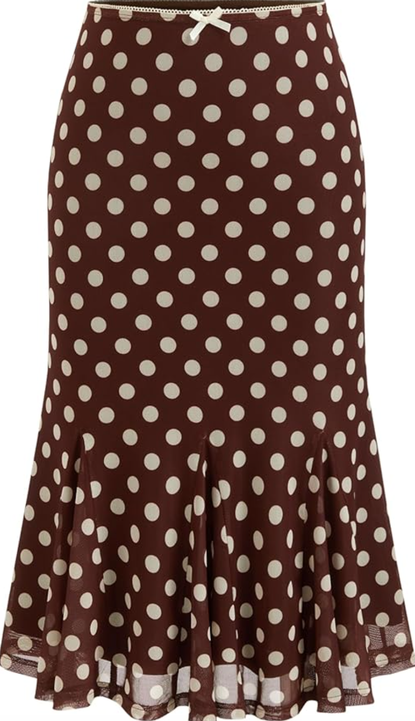 A high-waisted chocolate brown midi skirt with large white polka dots and a subtle ruffle hem, shown on a white background.