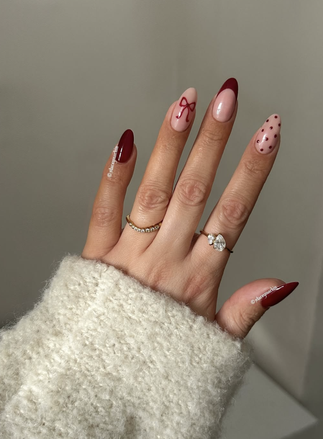 Red polka dot Christmas nails over a sheer neutral base