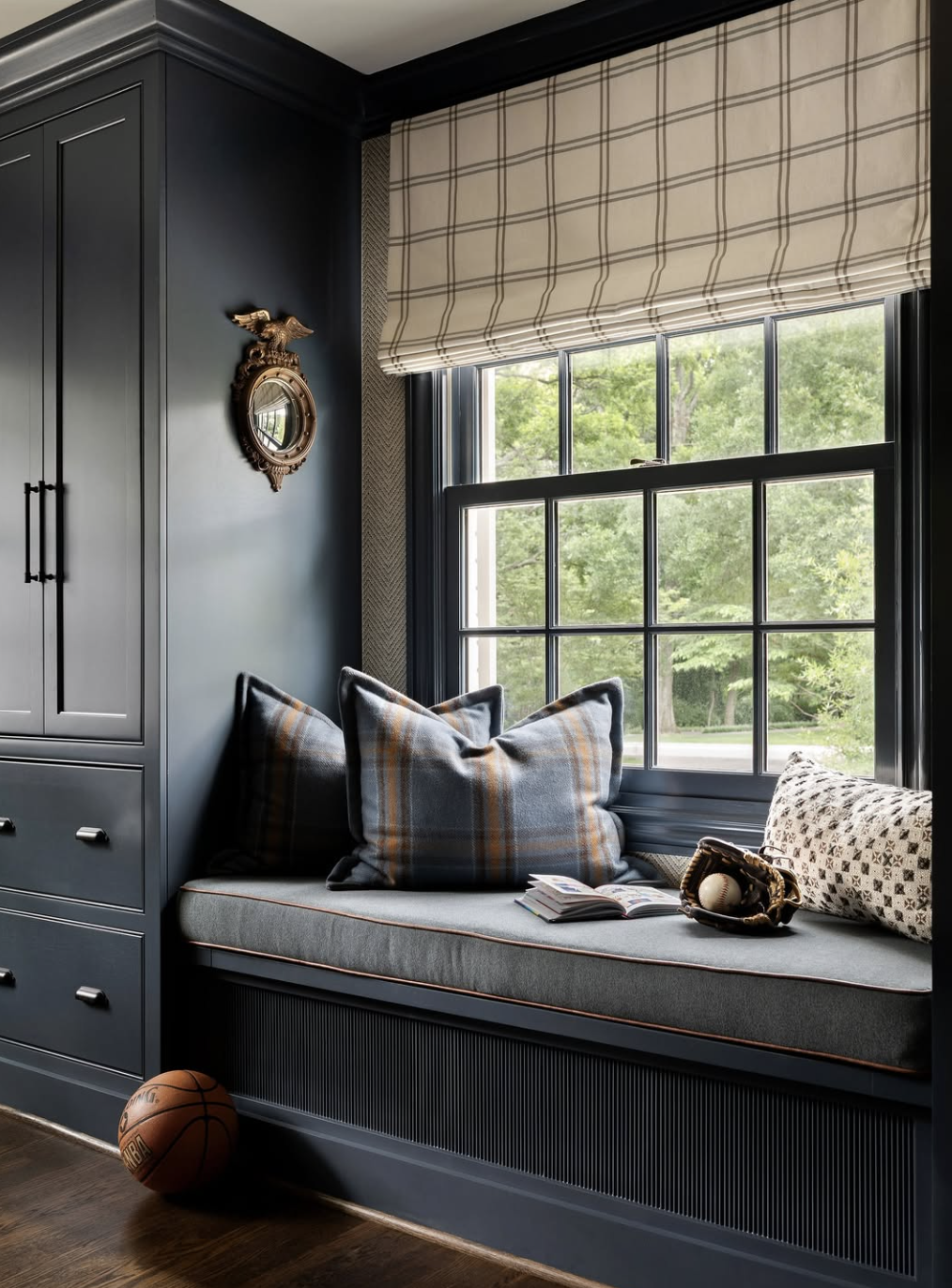 Smoky blue bedroom paint color paired with tobacco leather and oak tones