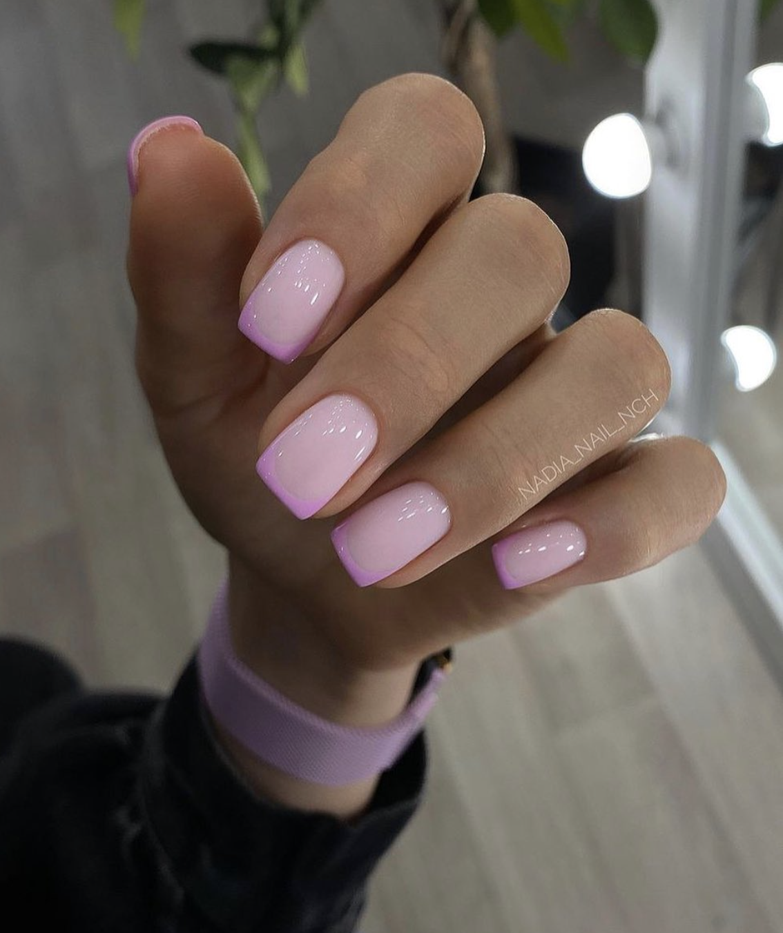 Short, elegant square nails featuring a clean, glossy sheer pink base coat with sharp, ultra-thin bright pink micro French tips.