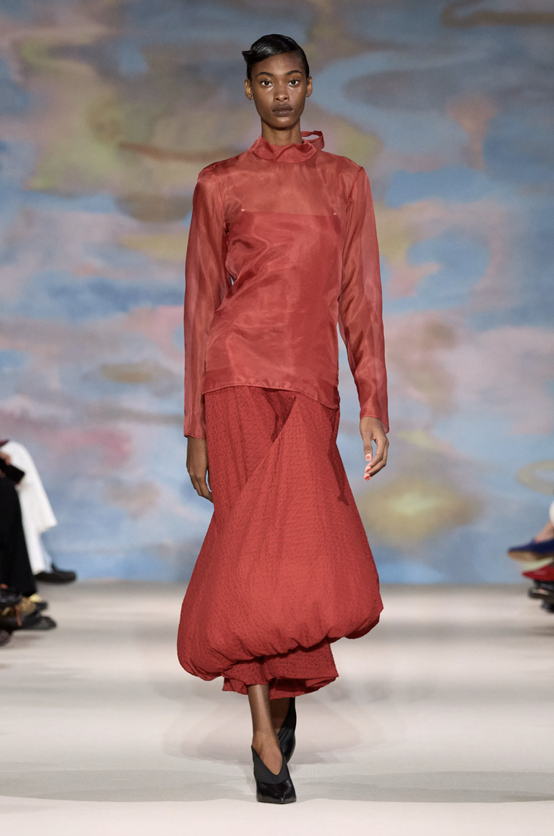 Alek Wek wears a white sculptural silk-organza dress with a rounded hem at Ahluwalia Spring 2027.