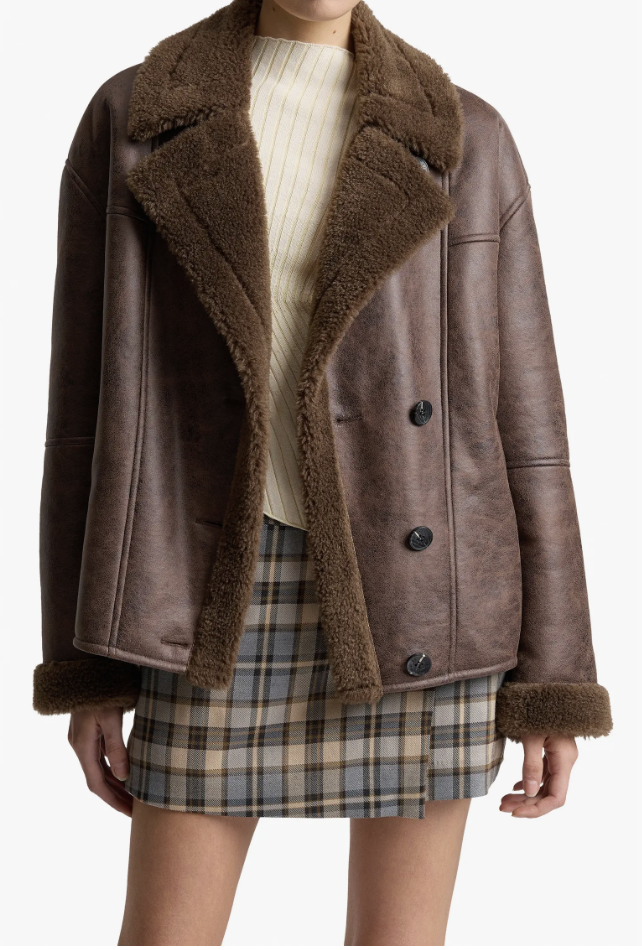 MANGO Adriana brown faux shearling jacket styled over a ribbed top and plaid mini skirt