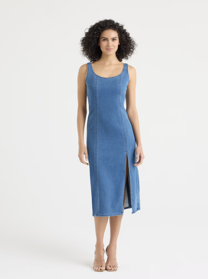 A woman wearing a sleeveless blue mock denim knit midi dress with a square neckline and a front slit, styled with tan heeled sandals.