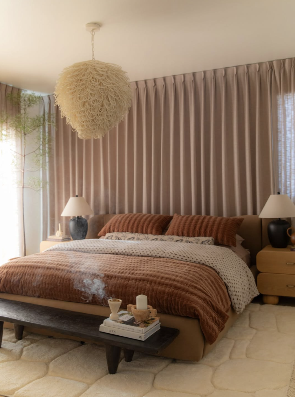 Collected bed styled with layered linen duvet, quilt and washed cotton sheets