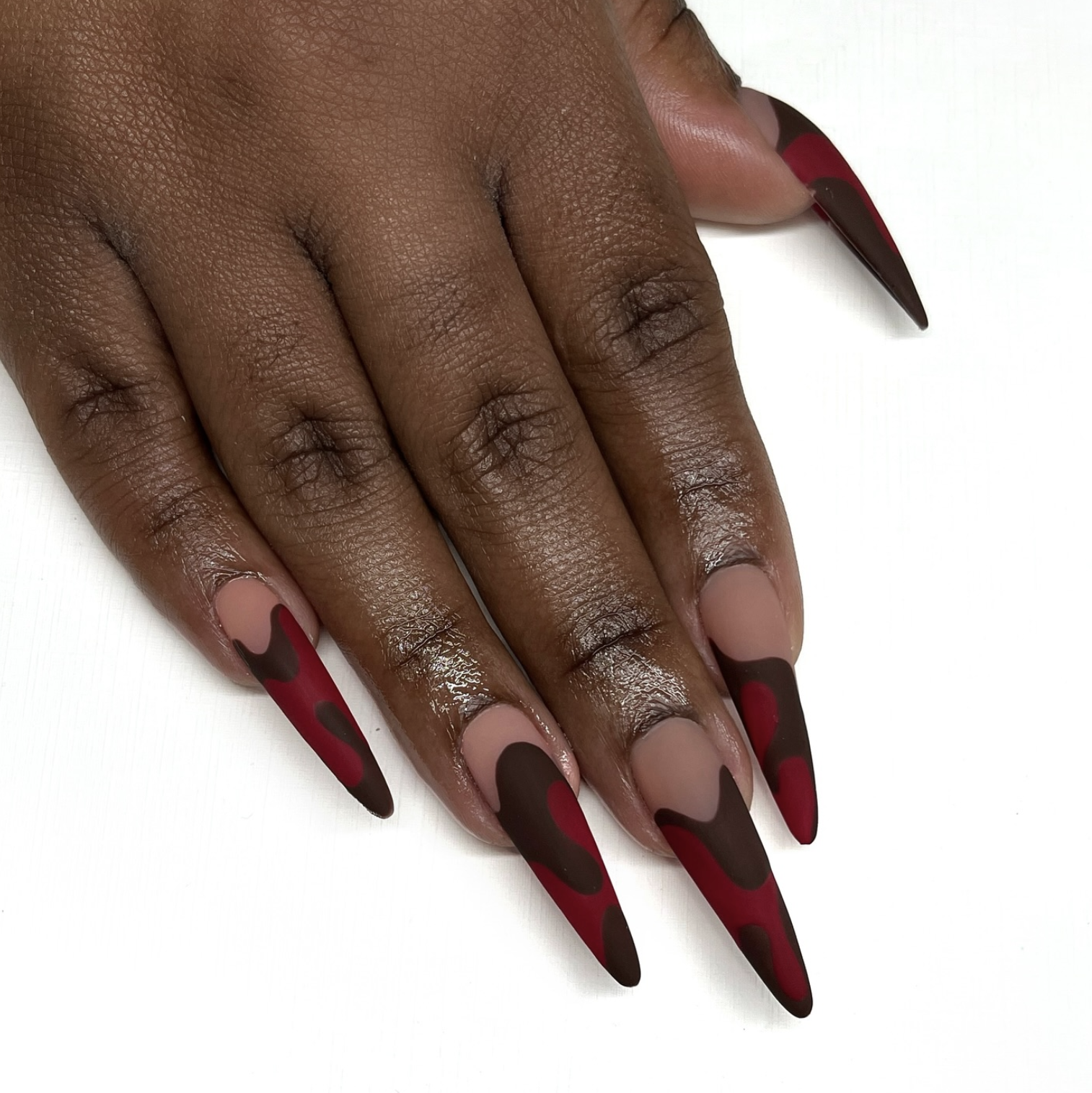 Soft square nails with diagonal chocolate-brown and berry-pink color blocks.