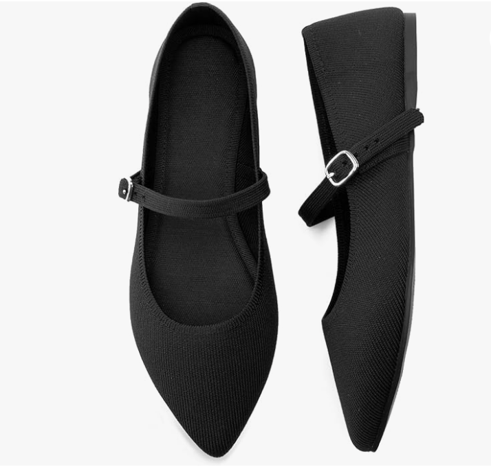 A pair of black pointed-toe Mary Jane loafers with a slim strap and silver buckle, styled as an elongating and versatile footwear staple for a 2026 capsule wardrobe.