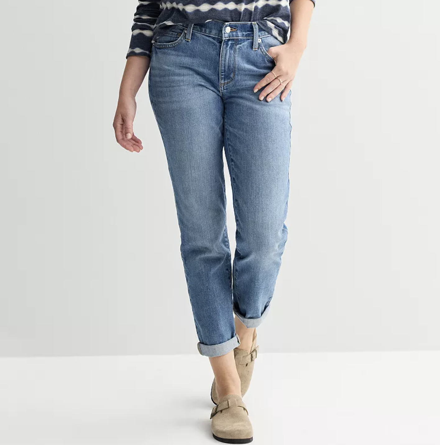 Model wearing Sonoma Relaxed Boyfriend Jeans in a light wash with a subtle taper and rolled cuffs, providing a comfortable and lived-in fit for muscular legs and a rectangle body shape.