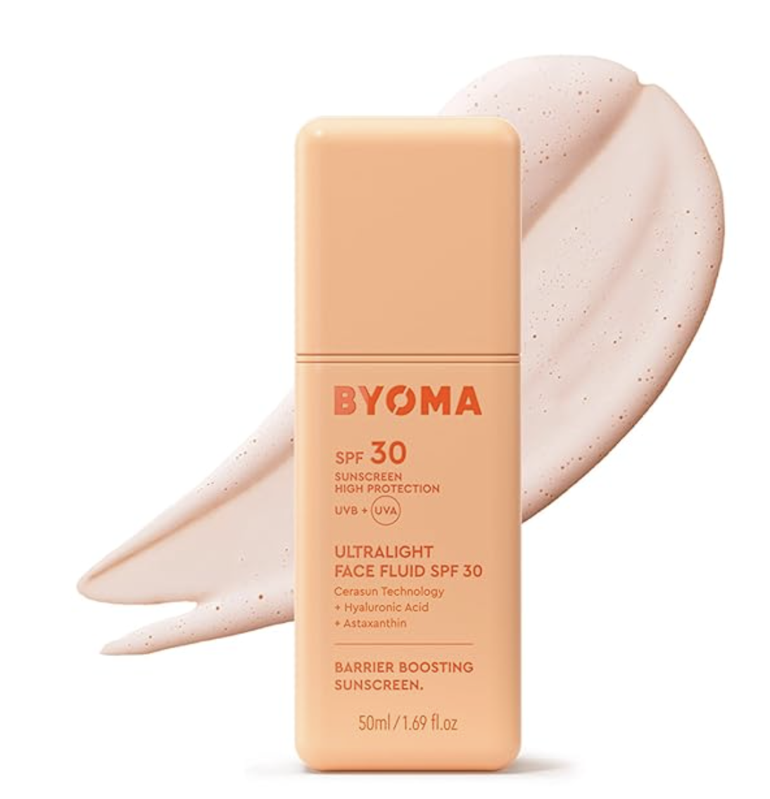 A peach-colored bottle of BYOMA SPF 30 Face Fluid sunscreen shown next to a large, creamy swipe of the product to demonstrate its lightweight texture.