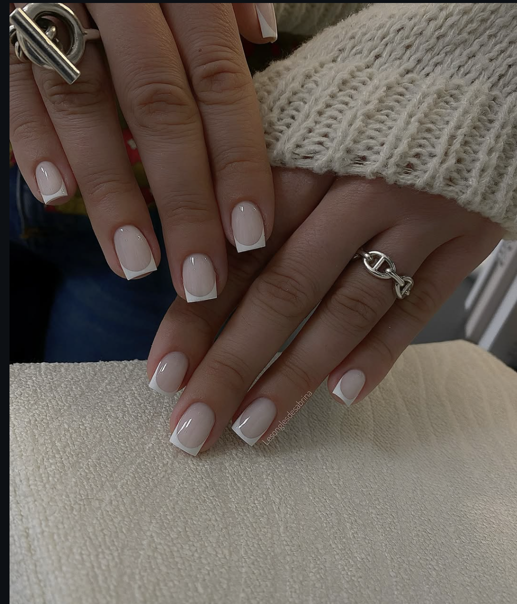 Square-shaped nails with a creamy, warm ivory base and a thick, soft white French tip.