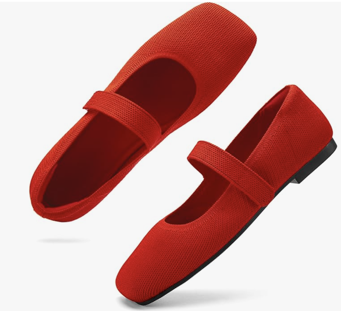 A pair of cherry red knit Mary Jane flats with a square toe and a stretchy matching strap on a transparent background.