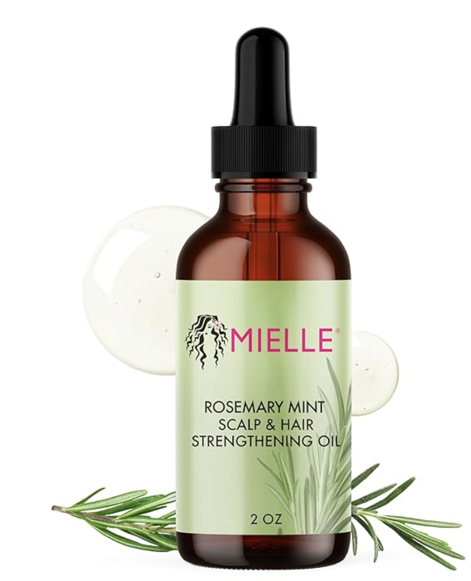 An amber glass dropper bottle of Mielle Organics Rosemary Mint Scalp and Hair Strengthening Oil with a white and green label, shown against a clean background with a clear liquid drop.