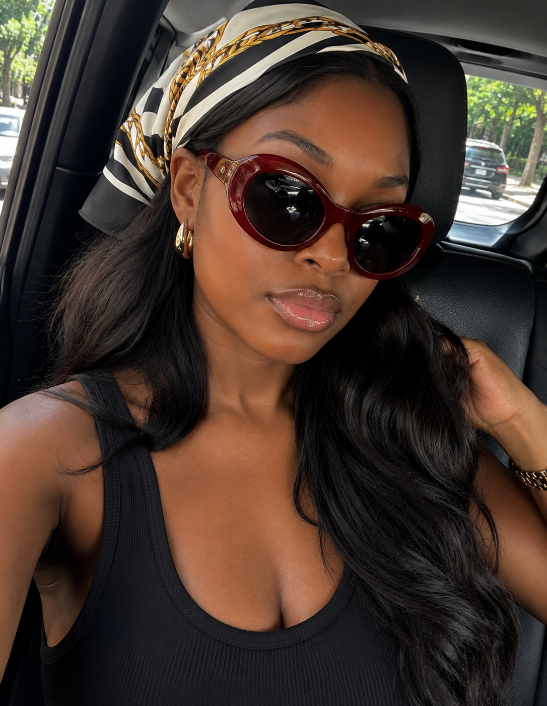 Woman wearing oversized bug-eye shield sunglasses with dark lenses, a top 2026 eyewear trend for a bold statement look.