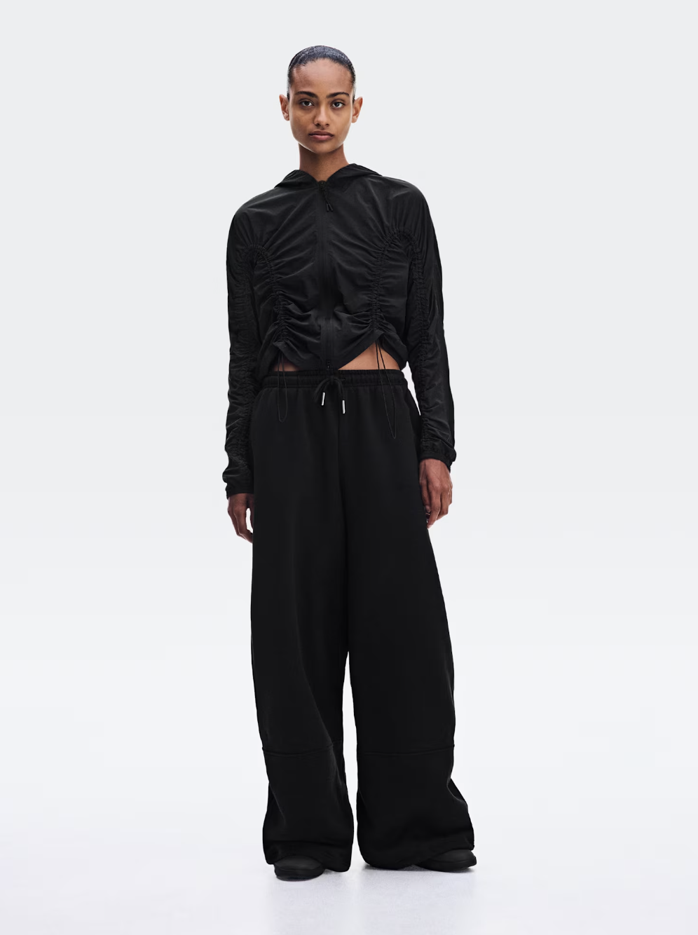 Black ruched lightweight jacket and matching pants from the Zendaya and Law Roach On collection.