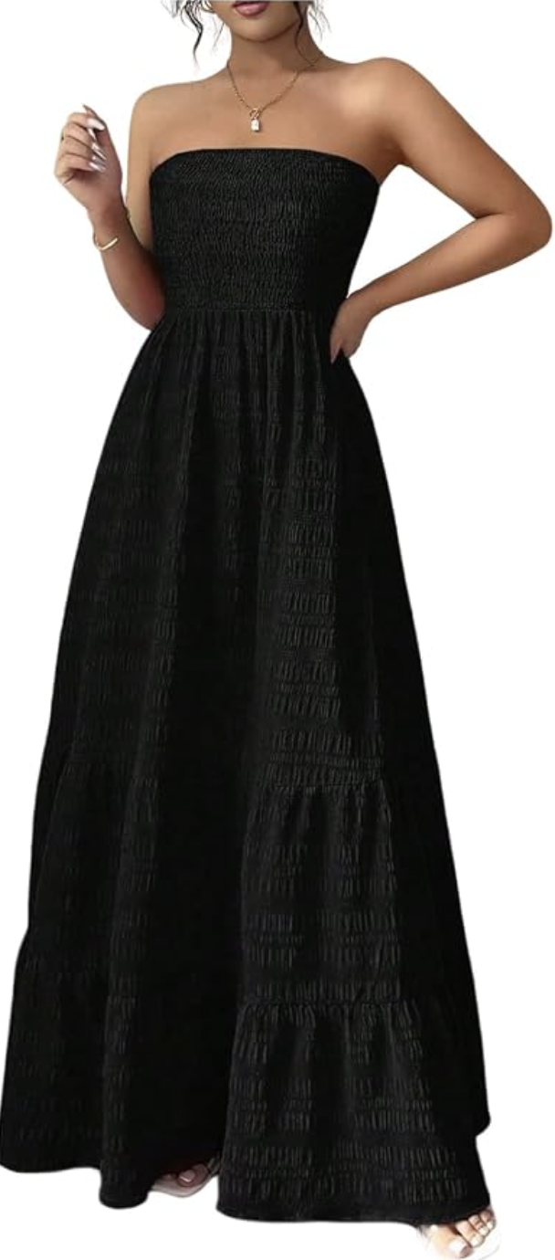 A close-up of a person wearing a black strapless maxi dress featuring a smocked elastic bodice.