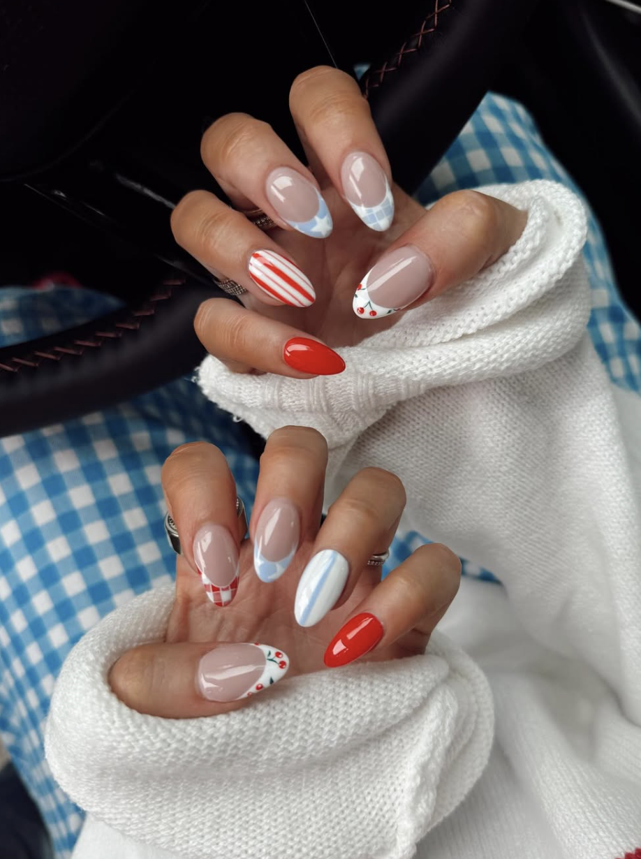 Long, almond-shaped nails with a chic, mismatched 4th of July design, featuring classic red-and-white gingham, clean red-and-white stripes.