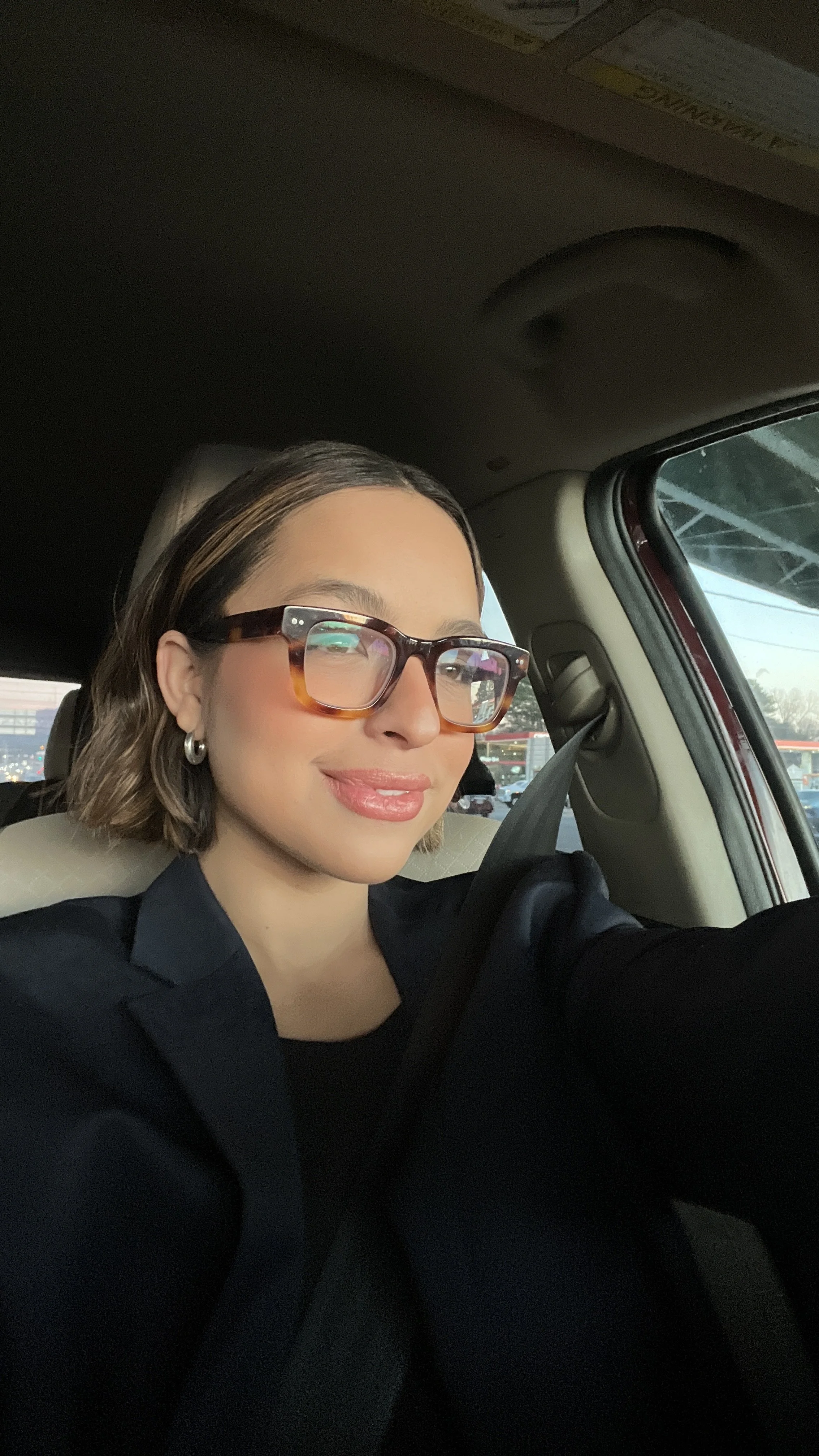 Woman with an oblong face shape wearing eyeglasses, styling inspiration for oblong face frames.