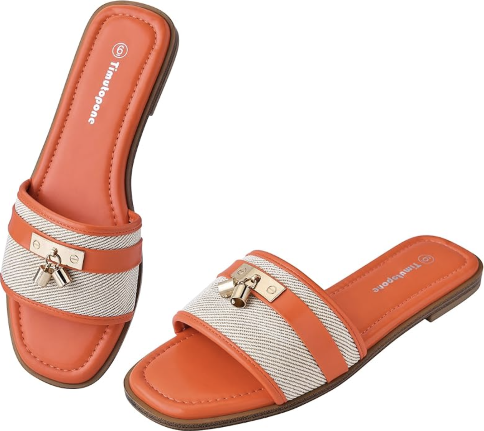 A pair of orange and canvas H-band flat slide sandals featuring a small gold padlock charm, styled as a comfortable yet expensive-looking resort shoe.