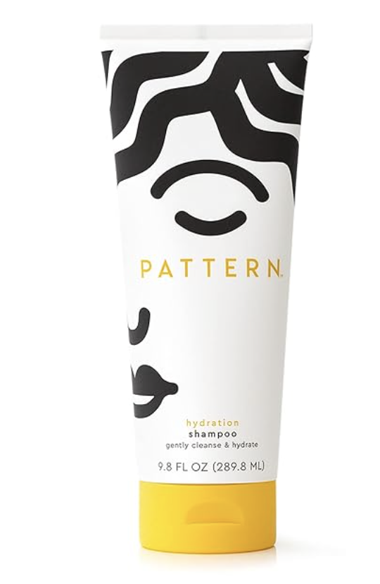 A bottle of Pattern Beauty Hydration Shampoo with Honey and Aloe Vera for deep moisture and curl detangling.